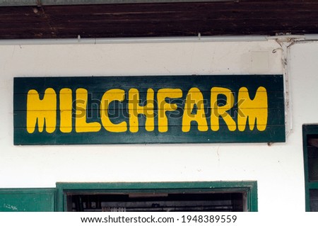 milk farm sign in german (Milchfarm), farm sale of dairy products