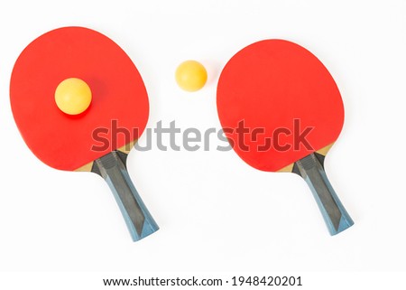 table tennis racket and ping-pong ball on white ground