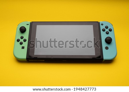 top view of a game console controller - special edition - yellow background
