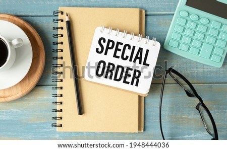 Text sign showing Special Order. Text Special Order on notepad on a wooden background.