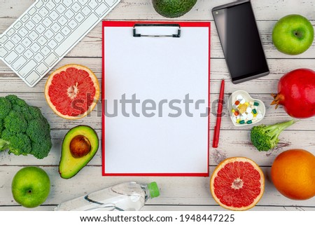 Healthy lifestyle workout concept with training equipment. The idea of how to achieve harmony and longevity while doing sports. Empty Clip board for mock up. Royalty-Free Stock Photo #1948447225