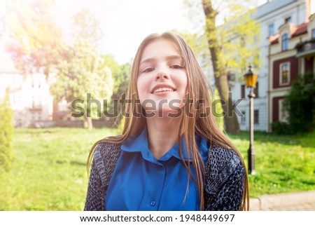 Portrait of a beautiful girl in park.