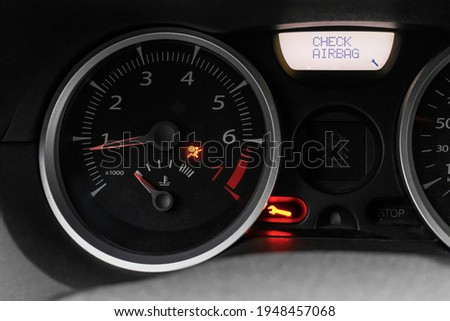 Car dashboard with airbag error warning, malfunction. Car service and repair. The dashboard is close. Royalty-Free Stock Photo #1948457068