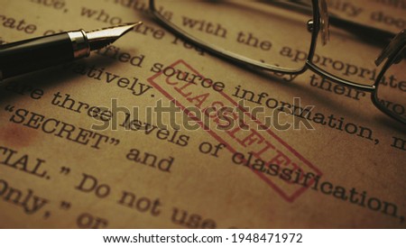 Close up of classified document-top secret Royalty-Free Stock Photo #1948471972