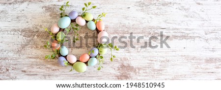 Rustic modern farmhouse Easter web banner with pastel egg wreath