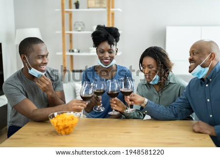 African American Having Wine Party Wearing Mask