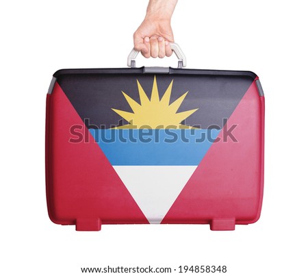 Used plastic suitcase with stains and scratches, printed with flag, Antigua and Barbuda