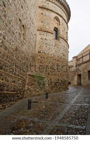 Ancient city of Toledo, Spain. View of the empty alley, street and building made of stones. Beautiful architecture and design.  