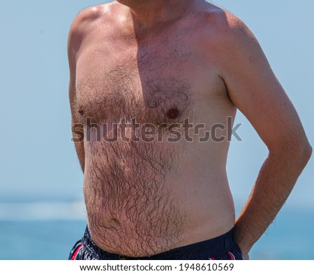 Close-up of a man's hairy chest.