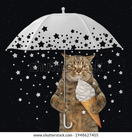 A beige cat eats a cone of ice cream under a white umbrella with shooting stars. Black background.