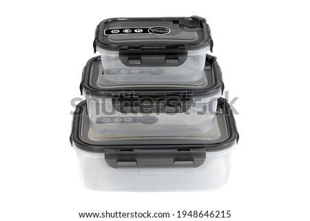 Empty plastic containers with airtight lids for food storage, compatible with microwave and dishwasher Royalty-Free Stock Photo #1948646215