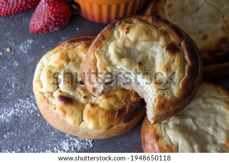 Authentic Russian open pies made of cottage cheese. Vatrushka - Traditional Russian open pie with cottage cheese. Sweet breakfast recipes. 