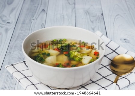 Colorful fresh clear spring soup - vegetarian stock