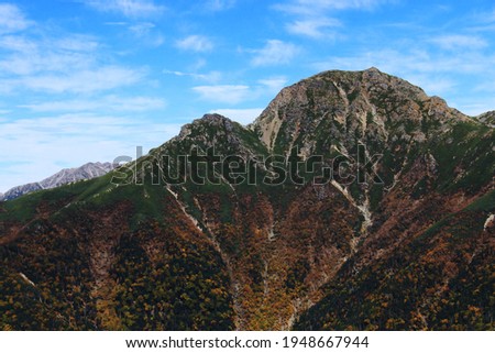 Road to the summit of Mt.Shiomi in the Southern Alps、Superb view of Mt.Shiomi from Mt.eboshi,ina city,nagano prefecture,japan Royalty-Free Stock Photo #1948667944
