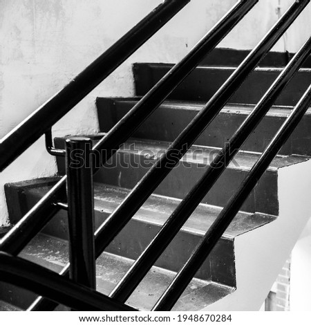 Black And White Image Of An Internal Public Car Park Staircase or Stairs With No People
