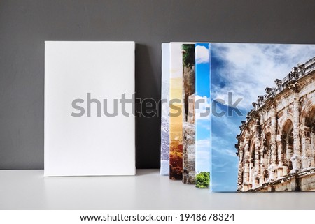 White canvas mockup, photo canvas prints on grey wall. Blank canvas stretched on frame