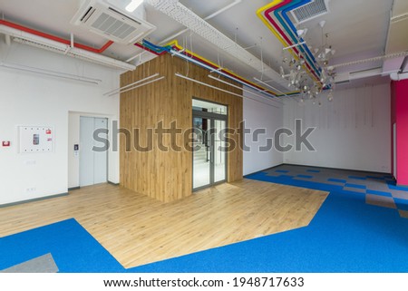 Interior photography, large office center in a modern style, with colored walls, unfurnished, open space, unfurnished