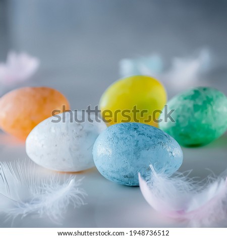 Easter concept. Colorful decorative eggs on a light background. Soft focus.