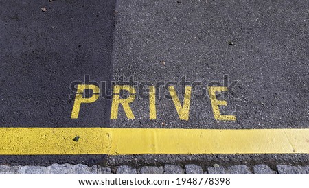 Private parking sign in the pavement