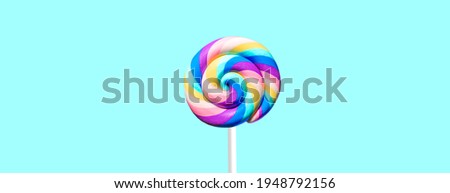 large round lollipop on a blue background