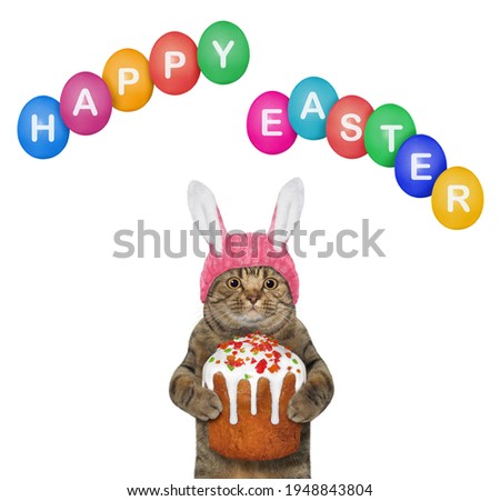 A beige cat in a pink easter bunny hat holds an easter cake. Happy easter. White background. Isolated.