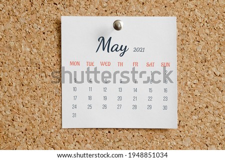 Page from the calendar for the full month: May 2021. White calendar sheet is attached to brown cork board. The concept of calendar date. Royalty-Free Stock Photo #1948851034