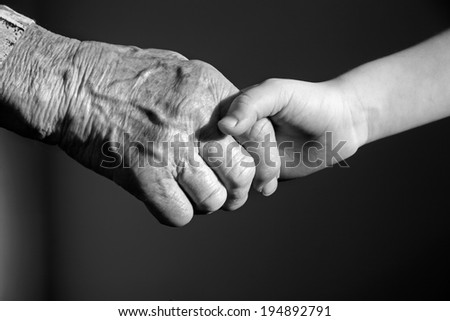 hand of grandmother and grandchild  Royalty-Free Stock Photo #194892791