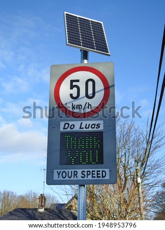 County Louth, Ireland, 6th December 2020. 50 kilometers an hour speed sign and neonspeed indicator on the way into Termonfeckin village. Do Luas is Irish for Your Speed.  Royalty-Free Stock Photo #1948953796