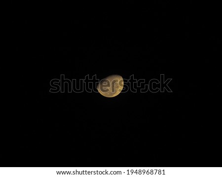 a photo of a moon in the sky at night