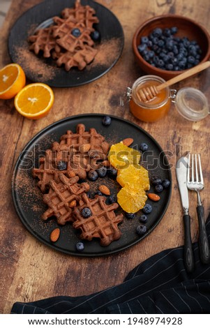 Waffles with orange, strawberry, almond and honey