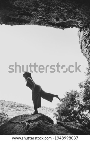Woman among the rocks of a mountain