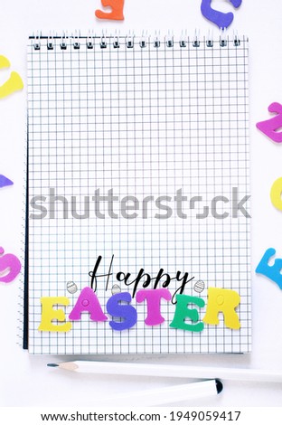 Holiday template happy easter in the concept of learning and school, colored letters, drawn eggs and text on the background of a squared notepad on a white background, empty space for text or pictures