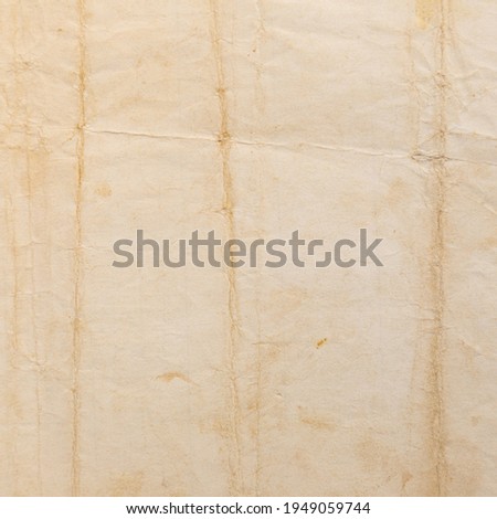 Recycled brown creased paper background or cardboard surface from a paper box