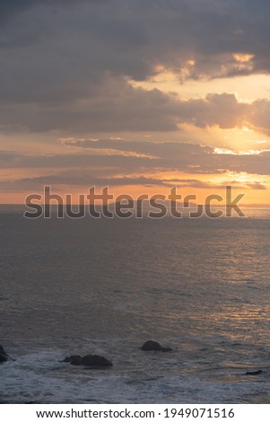 Beautiful colors of a sunset in the pacific ocean in the magical beaches of Costa Rica