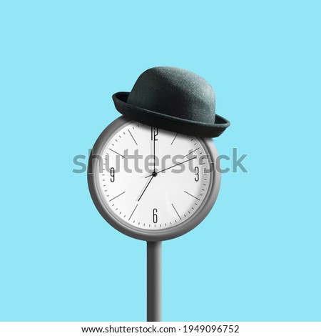 Street clock in a hat, on a blue background. Business and time concept. Isolated.