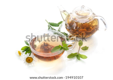 tea of chamomile flowers on white background