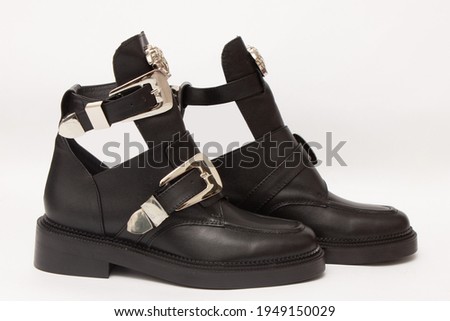Women's black winter boots, on a white background