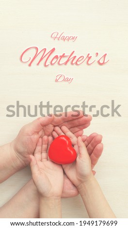 Concept Happy Mother's Day or International Day of Families.Happy women's day.Heart in the hands of daughter and mother on white background.I love you.Banner for store.Greeting card. Vertically