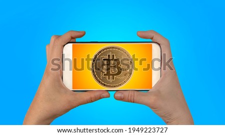 Bitcoins and New Virtual money concept.Gold bitcoins with Candle stick graph chart and digital background.Golden coin with icon letter B.Mining or blockchain technology

