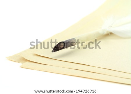 Quill pen on papers