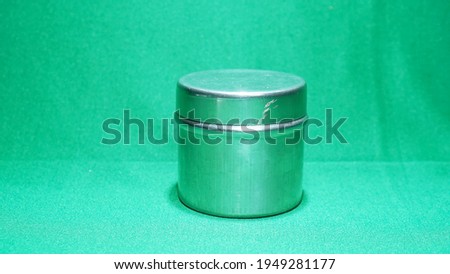           stainleesstell tube on green table. photo stock. high resolution                     