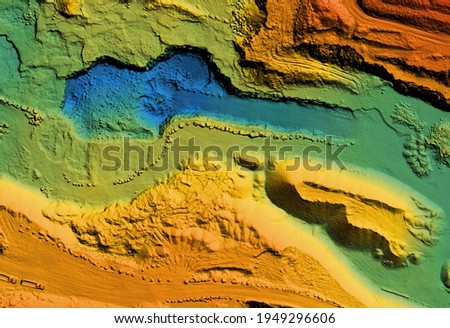 Model of a mine elevation. GIS product made after processing aerial pictures taken from a drone. It shows excavation site with steep rock walls Royalty-Free Stock Photo #1949296606