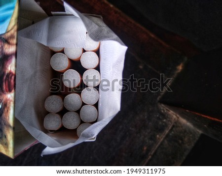 a pack of filter cigarettes