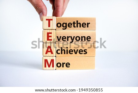 TEAM, together everyone achieves more symbol. Wooden cubes with words 'TEAM, together everyone achieves more'. Beautiful white background, copy space. Business, motivational and TEAM concept. Royalty-Free Stock Photo #1949350855