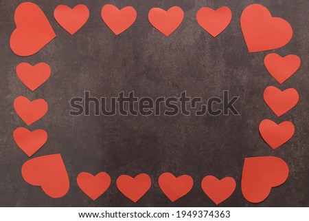 Heart Border, Valentine's Day, Love Border, Red Heart Border Background, Valentine's Day Card Background.
Red heart border on a black background, in the middle space for your text. Top view flat lay.