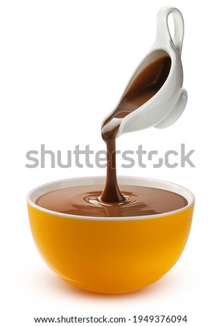 Pouring melted chocolate isolated on white background with clipping path Royalty-Free Stock Photo #1949376094