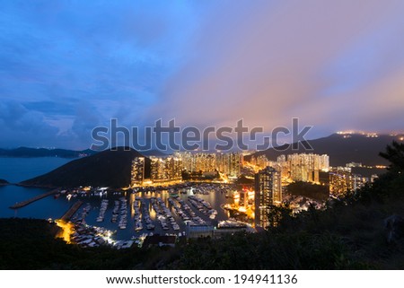 Hong Kong night scene with harbor and skyscrapers in Aberdeen, Hong Kong, Asia.