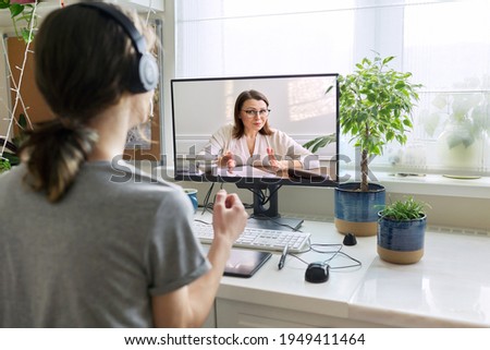 Online consultation of male teenager by social worker, psychologist, behavior, teacher Royalty-Free Stock Photo #1949411464