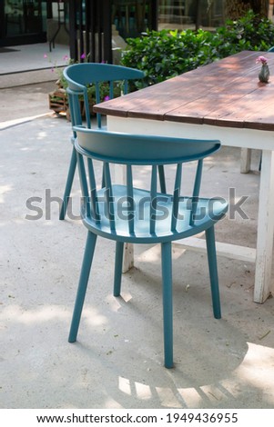 Beautiful green summer garden with outdoor chair, stock photo
