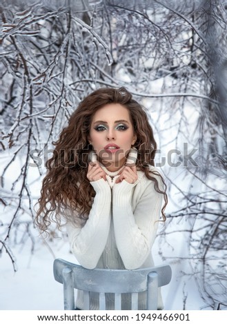 Beautiful young girl in the winter forest. Winter. Ice forest. White 